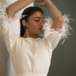 White feathered sleeve with belted top